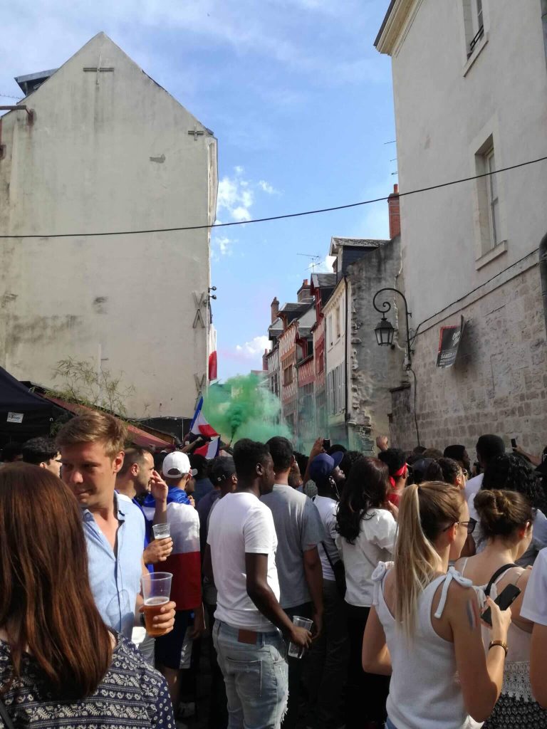 People watching the World Cup in the street