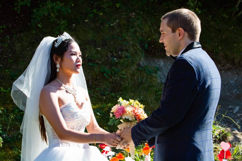 Mr and Mrs The Poor Swiss exchanging vows